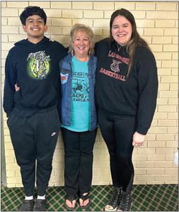 Rotary Students of the Month for April are Cameron Munoz (left), son of Kimberly Munoz, and Madi Barnard (right), daughter of Sherri Barnard. They are pictured with Rotarian Karen Caldwell. Courtesy photo
