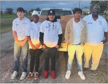 Courtesy photo Crystal Gate Lodge 173 and Marvin Smith Council #6 passed out Thanksgiving baskets for the community of Frederick. Pictured are Leilynd Kelley, Brayden Perry, Alfonso Ramos, Kayne May and director Cedric Edwards. Marcus Hunter, Worshipful Master of Crystal Gate Lodge also helped.