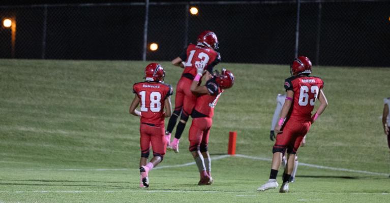 Teammates celebrate after number 13 Braylin Hunt achieved his first touchdown of his high school football career. Courtesy photos | Julie Tyler