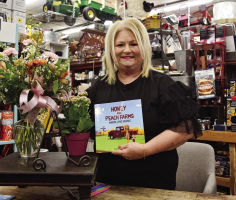Local author, Dana Patterson, recently held a book signing for her debut children’s book, “Honey and Peach Farms: Where Love Grows.” Kathleen Guill | Press-Leader